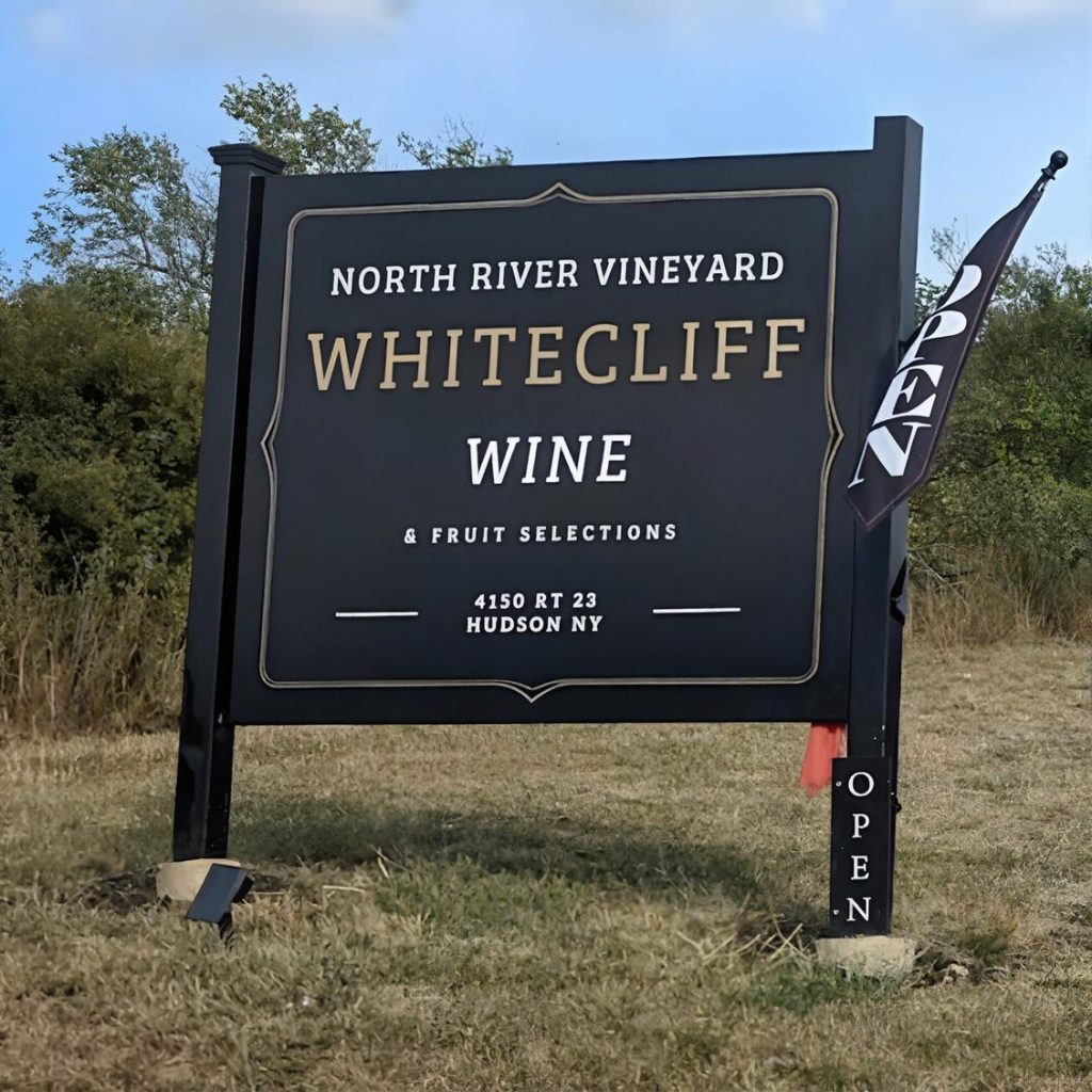 Entrance sign for Whitecliff Vineyard at Hudson in the Hudson Valley during a chauffeured wine tasting tour from Westchester County.